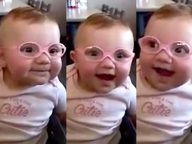 baby girl glasses first time sees family