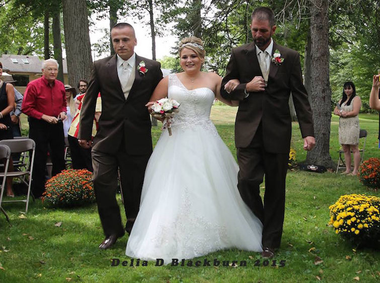Bride's Father Halts Wedding So Daughter's Stepdad Can Walk Down the Aisle with Them