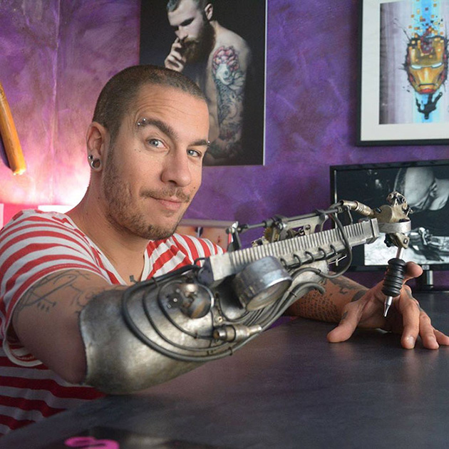 prosthetic arm tattoo artist