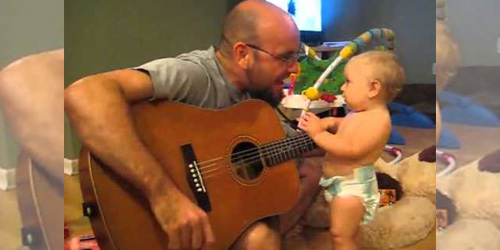 Baby Rocks Out While Dad Plays The Guitar