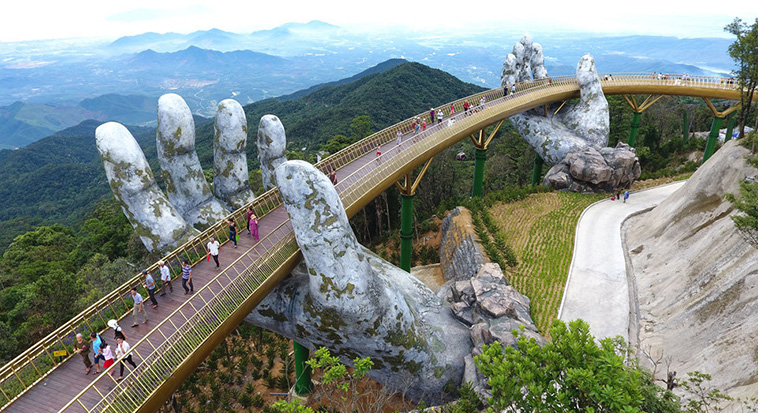 Giant Hands Raise Bridge in Vietnam