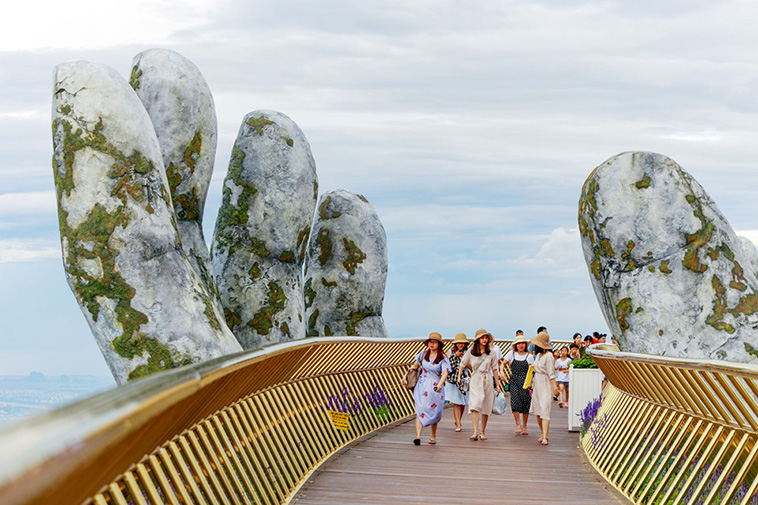 Giant Hands Raise Bridge in Vietnam