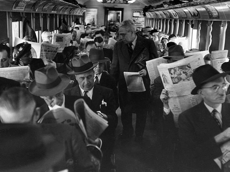 newspaper on train