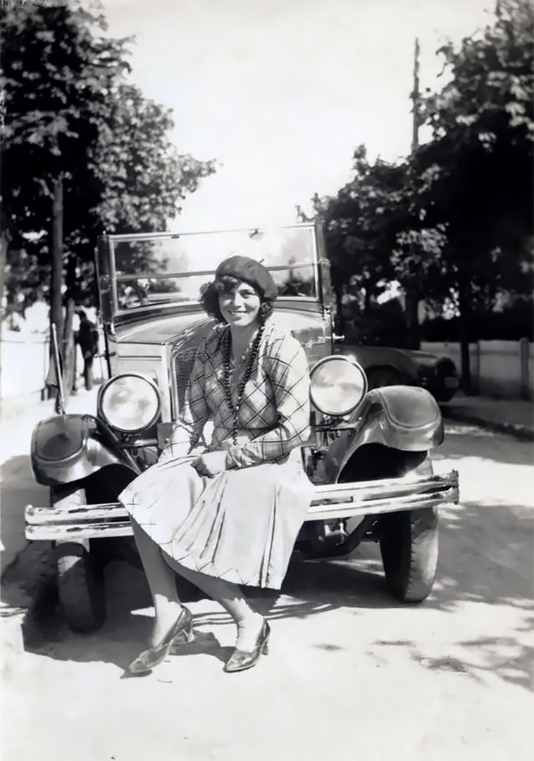 girl posing with car
