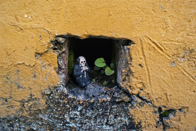  miniature cement skeletons