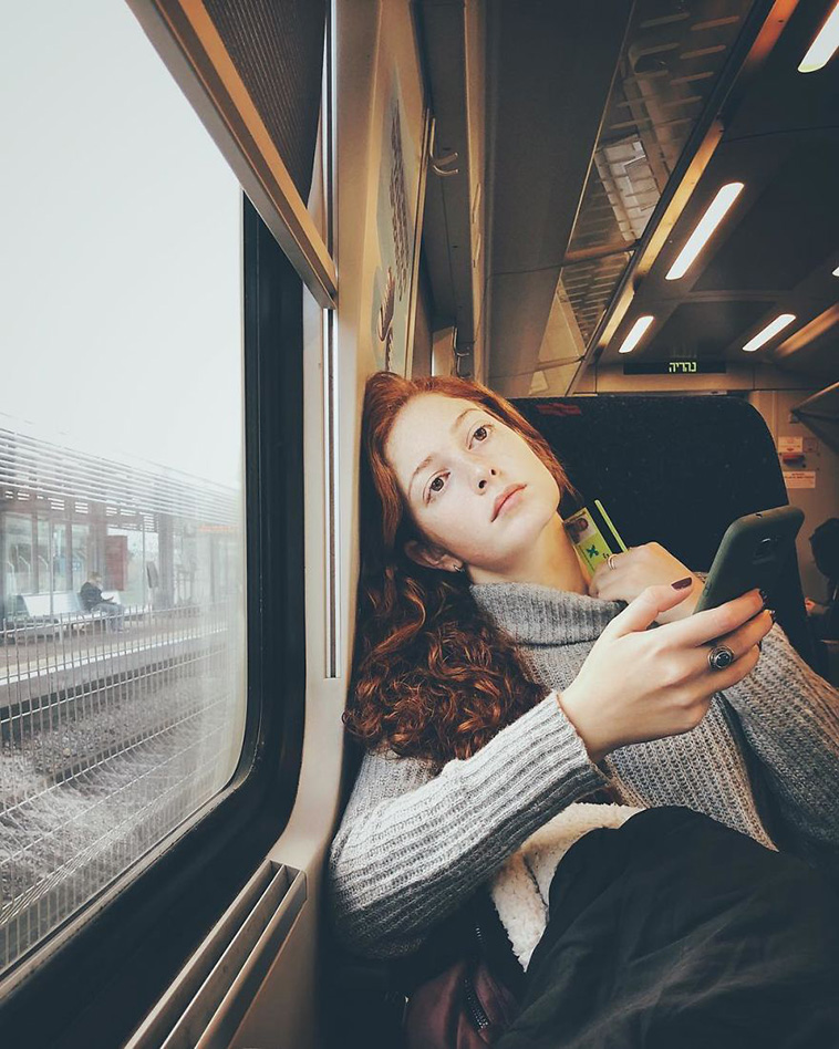 woman uses iphone photograph strangers