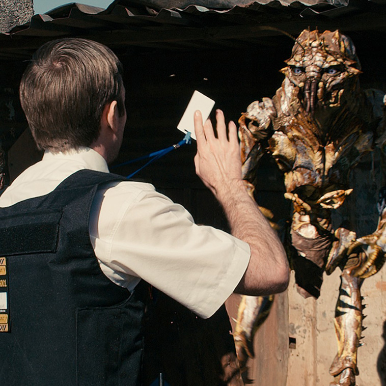 An image from District 9 with Wikus and an alien