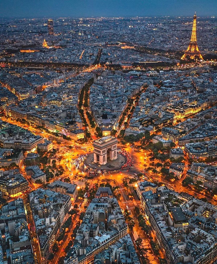 arc de triomphe in a photo of paris from above 